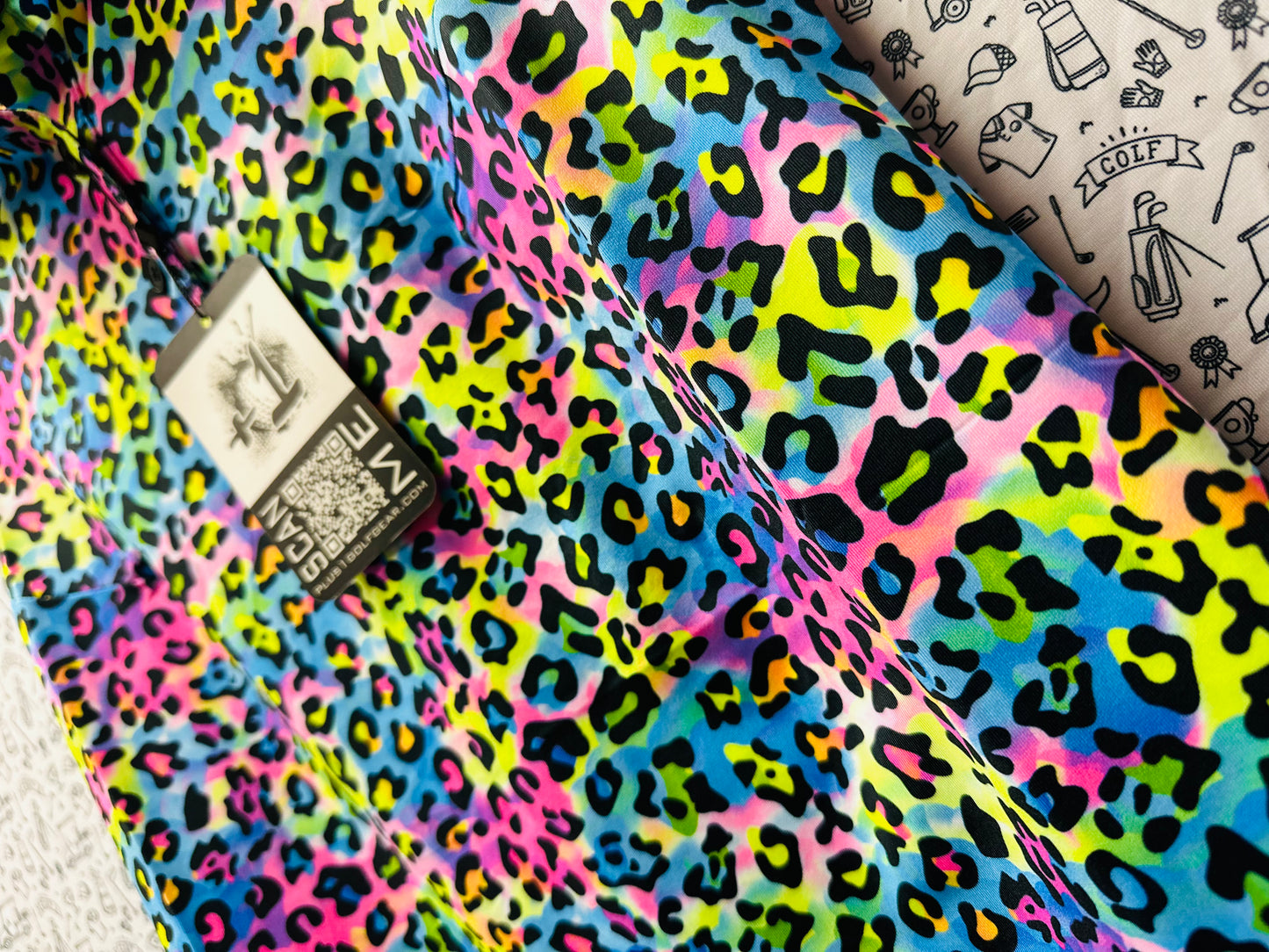 WOMEN'S NEON LEOPARD PRINT SLEEVELESS POLO